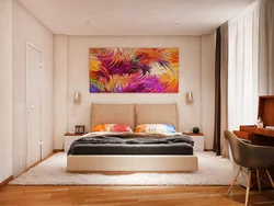 Large paintings in the bedroom above the bed photo