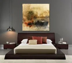 Large paintings in the bedroom above the bed photo