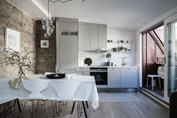 Gray floor and gray walls in the kitchen interior photo