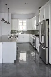 Gray floor and gray walls in the kitchen interior photo