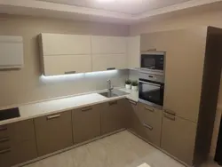 Matte beige kitchen in the interior photo