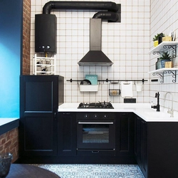 Photo of a kitchen with a gas pipe and water heater