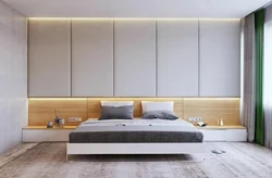 Wardrobes above the bed in the bedroom design