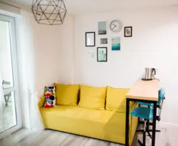 Yellow Sofa In The Interior Of The Kitchen Living Room