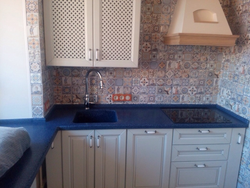 Kitchen With Blue Countertop And Apron Photo