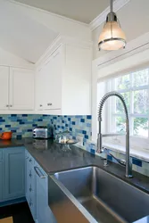 Kitchen With Blue Countertop And Apron Photo