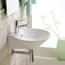 Bathtub with wall-hung sink photo