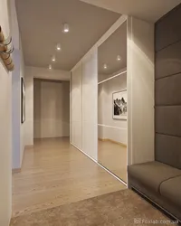 Wardrobe in a long narrow corridor in an apartment photo