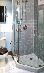 Photo of a bathroom with a tray instead of a bathtub