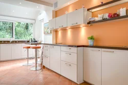 Peach-colored kitchen in the interior photo