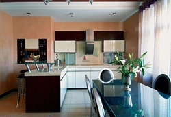 Peach-colored kitchen in the interior photo
