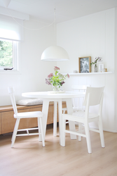 White kitchen table in the kitchen interior