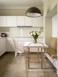 White kitchen table in the kitchen interior