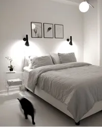 One lamp above the bed in the bedroom photo