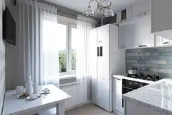 Kitchen refrigerator by the window photo design