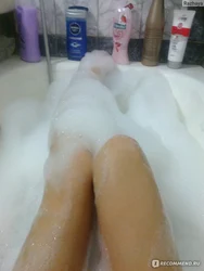 Photo of feet in bathtub with foam