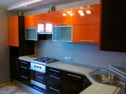 Orange-Black Kitchen In The Interior Photo