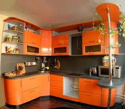 Orange-black kitchen in the interior photo