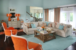 What colors goes with orange in the living room interior?