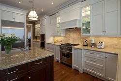 White kitchen with brown countertop photo in the interior