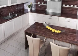 White kitchen with brown countertop photo in the interior