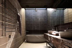 Photo Of A Bathroom With Dark Tiles
