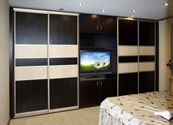 Wall-to-wall wardrobe in the living room design