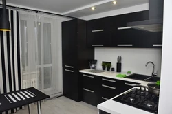 Kitchen with black refrigerator design photo