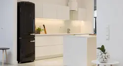 Kitchen with black refrigerator design photo