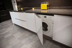 Washing Machine In The Kitchen Under The Countertop Photo