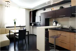 Kitchen in a studio with a bar counter design 25 sq m