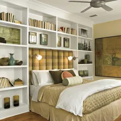 Bedroom interior with shelves on the entire wall