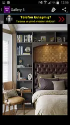 Bedroom interior with shelves on the entire wall