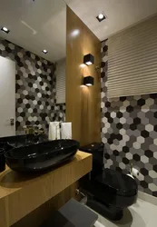 Bathroom design with black toilet and sink