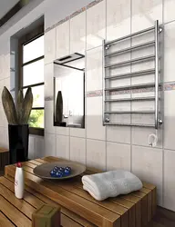 Электрычны полотенцесушитель у ванным пакоі фота