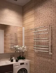 Electric heated towel rail in the bathroom photo