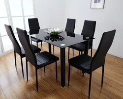 Black table and chairs in the kitchen photo