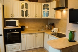 Kitchen in efficient apartments photo