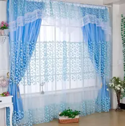 Blue curtains in the kitchen interior photo