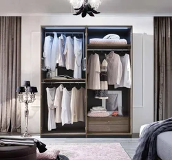 Wardrobe in the bedroom for clothes inside photo