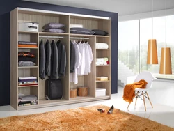 Wardrobe in the bedroom for clothes inside photo