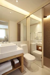Bathroom with wall-to-wall mirror photo