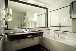 Bathroom With Wall-To-Wall Mirror Photo