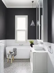 Bathroom design with dark floors and light walls