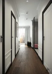 In the hallway there is a light floor in the interior photo