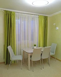 Olive curtains in the kitchen interior