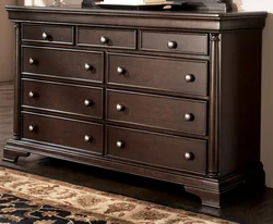 Chest of drawers in the bedroom made of wood photo