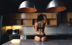 In underwear in the kitchen photo