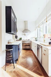 Photo of a narrow kitchen in a house with a window