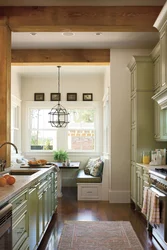 Photo of a narrow kitchen in a house with a window